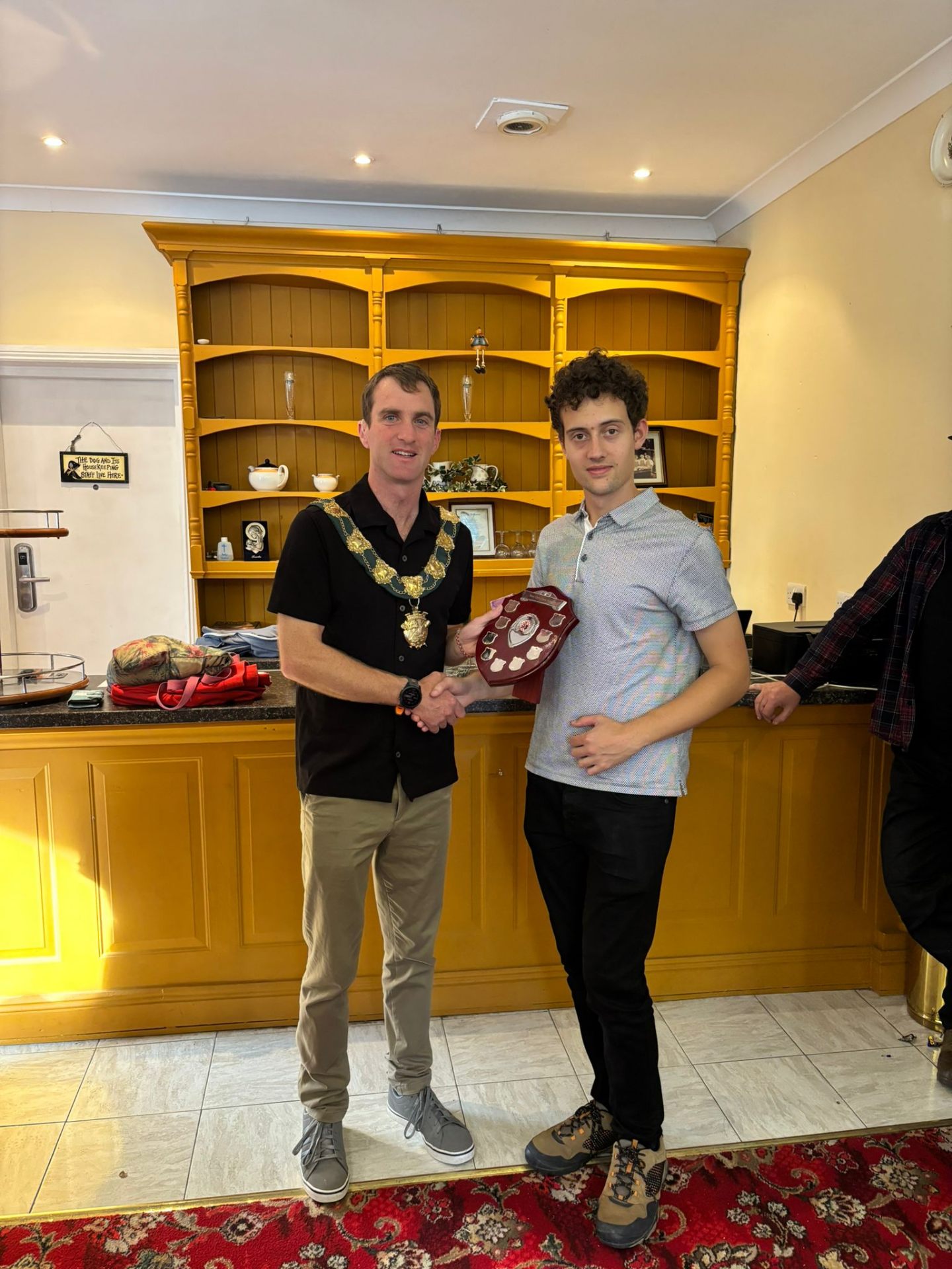 Bantry Chess Club player receiving the West Cork Chess League shield from the Mayor of Clonakilty